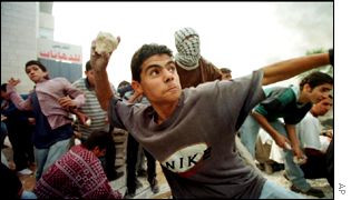 Palestinian youths throw stones at Israeli forces